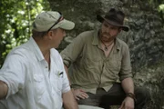 Josh Gates, Epigrapher Stanley Guenter, and Victor Mendoza admire a snake emblem hieroglyph at the National Museum of Archeology in Guatemala City, Guatemala.