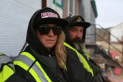 Karla Charlton wearing sunglasses and Ryan Hofer.