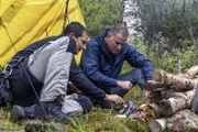 Norway - (L to R) Bear Grylls and Channing Tatum build a fire next to a lake  for National Geographic's RUNNING WILD WITH BEAR GRYLLS. (National Geographic/Ben Simms)