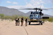 Nogales, Arizona, USA: Officers train with a blackhawk helicopter. Agents must train to prepare themselves for fights with drug smugglers and cartels.