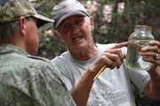 Jim Tom showing Mark Rogers his shine.