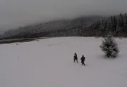 Bam Brown and Matt Brown cross the snow.