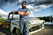 Niko leans on the GMC truck.