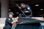 Nogales-Deconcini, Arizona, POE: U.S. Border Patrol officers start tearing open the roof of a suspected vehicle. The entire roof of the car is stuffed with wrapped Tupperware packages.