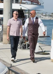 On left: Joe (Rob Corddry) and on right Spencer Strasmore (Dwayne Johnson)