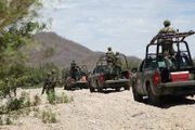 MEXICO- The Mexican Army driving to bust a methamphetamine superlab.