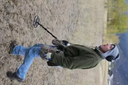 Butte, MT, USA: Tim Saylor at the location of the 5 Mile Bar & Grill with his metal detector.