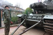 Ingo (l) in front of a tank.