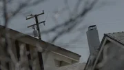 Phone and power lines above houses.