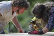 Gabe and Bam Brown sawing.