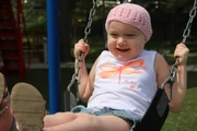 Lucy Wiese plays on the playground at the Children?s Inn.