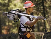 Ax Men Season2 The Reckoning Part2, Ax Men Staffel2 Ende Gelände
 Logger with chainsaw on shoulder..