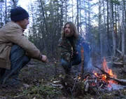 Bear and Matt build a fire to keep the ground from freezing.