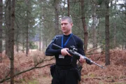 Breivik walks through the forest hunting down children to kill.