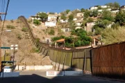 The border fence separating Nogales, Arizona and Nogales, Sonora, Mexico. Customs and Border Protection (CBP) teams fight to stop drug smugglers, human traffickers, and desperate migrants from entering the United States. officers