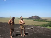 Jeff Zausch and E.J. Snyder walking out in the terrain wide shot.