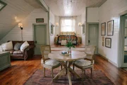 Ben & Erin Napier fashioned the perfect painting room and den for this historic house's brand new homeowners, Laura and Ross, as seen on Home Town. in a wide shot