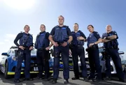 MELBOURNE - AUSTRALIA 7TH OCTOBER 2015 - Police Members from Highway Patrol pose for portraits in Frankston on 7th of October 2015 in Melbourne, Australia.