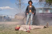 Standing: Tulip O'Hare (Ruth Negga)