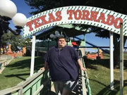 Justin is under the Texas Tornado sign.