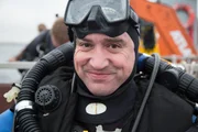 Baltic Sea, North of Gdynia,Poland - Stephen Burke gets ready to dive in the Baltic Sea.