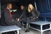 -- "Lock, Stock, Some Smoking Barrells and Burton Guster's Goblet of Fire" Episode 801 -- Pictured: (l-r) Dule Hill as Burt Guster , Vinnie Jones as Ronnie, Olivia D'Abo as Dierdre -- (Photo by: Alan Zenuk/USA Network)