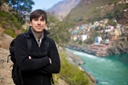 Simon Reeve by Ganges at Devprayag