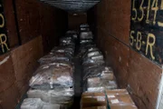 Laredo, TX: A truck bed filled with wrapped packages that may be filled with drugs. Drug smuggling happens in small and massive quanitities.