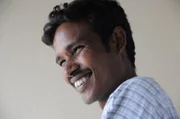 Arun Kumar smiling.