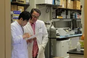 Dr. Tisdale reviews results with a coworker.