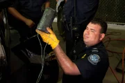 Laredo, TX: A Customs and Border Protection agent showing a package of drugs found in a suspected car that was trying to cross the border.