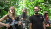 Reine gets picture taken with gun.
