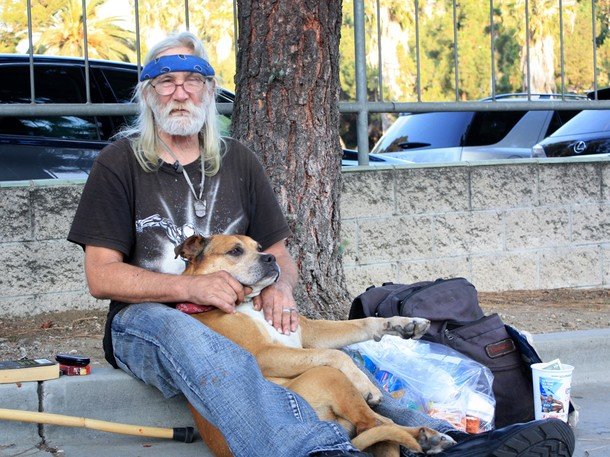 Homeless Vietnam Vet John panhandles for drug money outside the Hollywood Bowl with his dog.