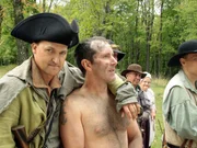 Ringy is comforted by KG during a short break from being tarred and feathered by an angry mob.