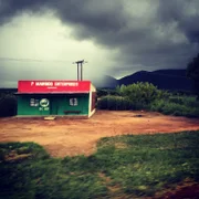 Clouds over a small village store.