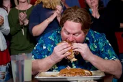 Host Casey Webb taking on The Pigzilla Challenge at Papa Buck's BBQ in Metter, Georgia, as seen on Travel Channel's Man v. Food.