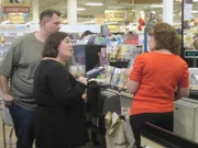 Tammilee and John at checkout.
