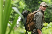 Joel Lambert trekking through the Panama forest.