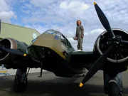 Kate Humble on the wing of a Bristol Blenheim at Duxford Airfield