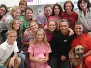 "Cesar posing with the staff of the Animal Hospital of Towne Lake."                               .