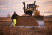 Casey Morgan leaning on Dozer