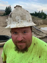 Close up of Nathan Clark covered in mud