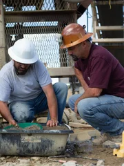 Jason Sanchez and Dave Turin panning for gold