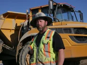 Casey Morgan standing in front of Rock Truck