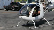 Heavy D (Dave Sparks) and Orville Neisingh in helicopter.