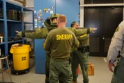 Tory tries on a bomb suit