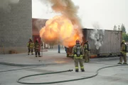 Tory and Tommy watch a backdraft explosion