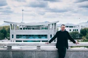 North Korea - Michael Palin on the border with South Korea in the background. (ITN Productions)