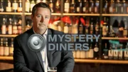 Host Charles Stiles at the bar, as seen on Food Network's Mystery Diners (500 and 600 series).