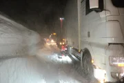 Eidfjord, Norway - BjĂ¸rn LĂ¦greid, main cast in Eidfjord is rescuing a truck on a slippery and snowcapped road.  (National Geographic)